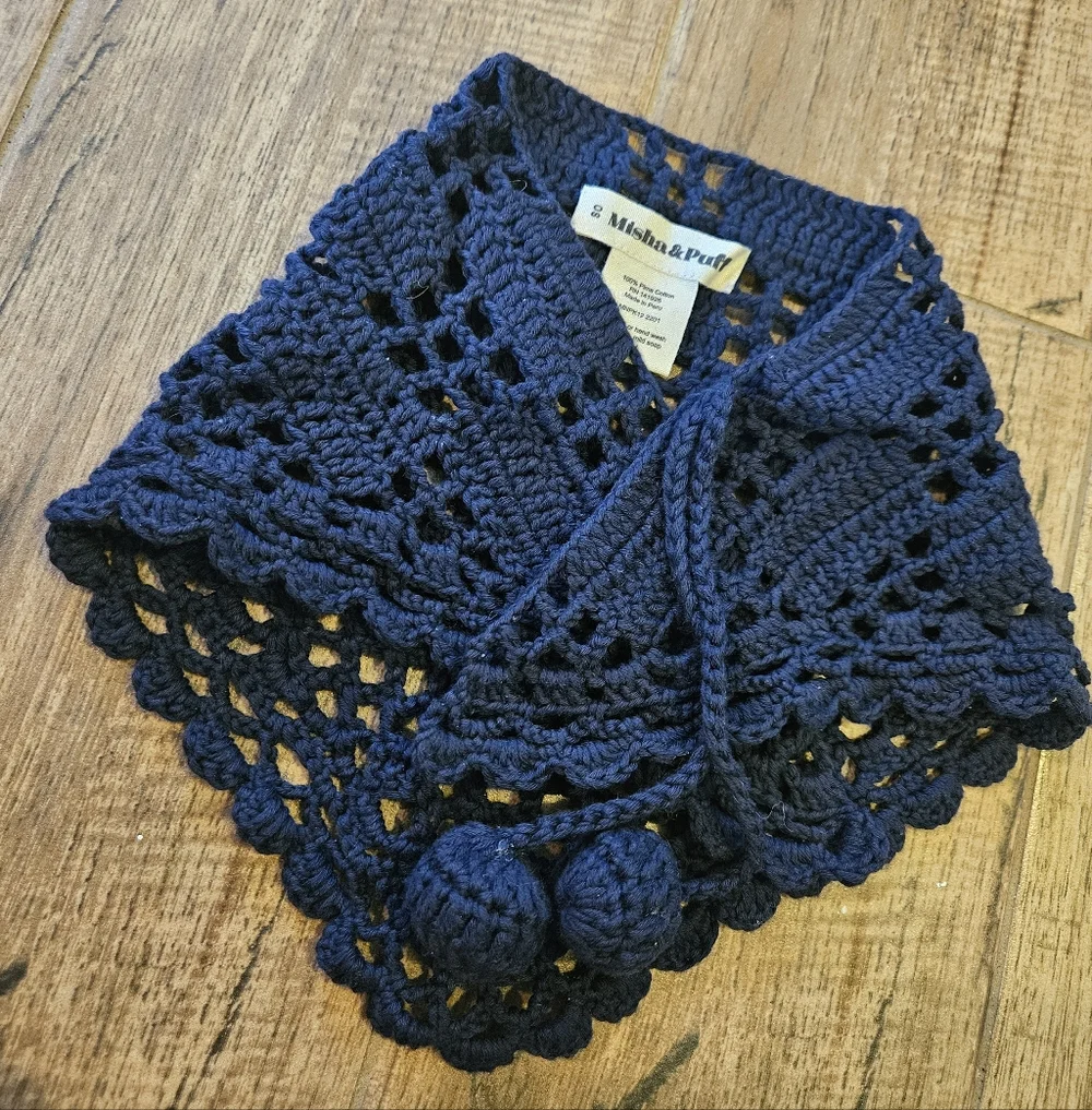 misha and puff black crochet scarf with pom poms